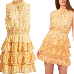 Yellow Mini Dress
 
Smocking at the neck and waist lends.